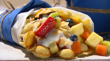 Homemade waffle cones with summer fruit salad