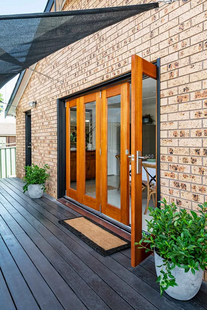 Timber bi-fold doors on timber deck