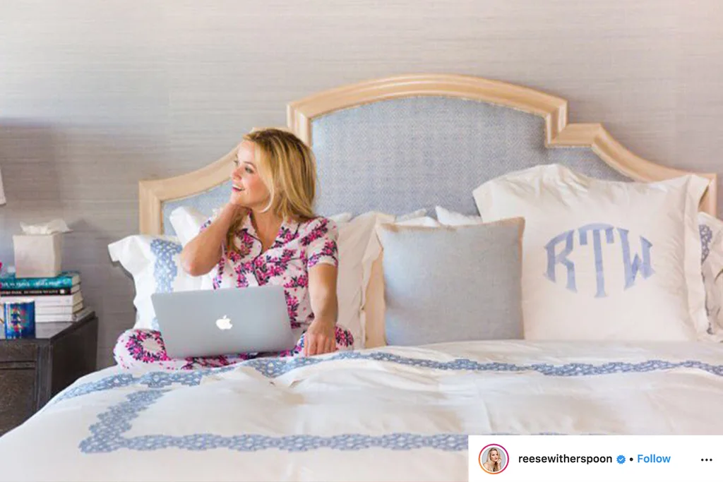 reese witherspoon sitting in bed