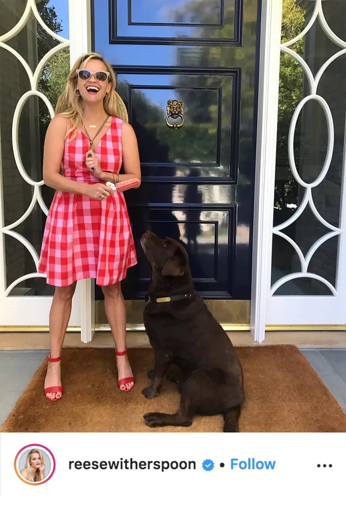reese witherspoon standing at front door