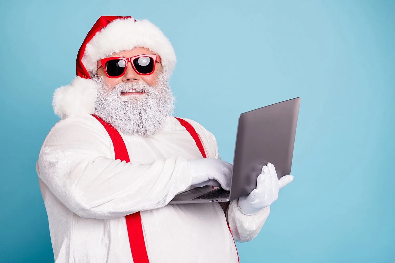 Santa holding a laptop