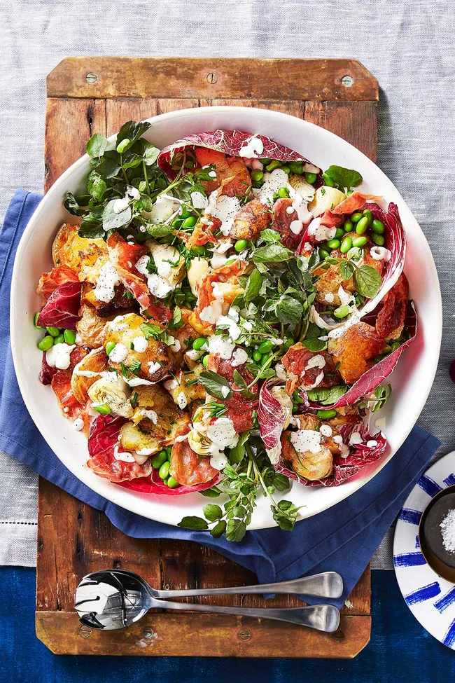 Warm smashed potato and radicchio salad with lemon aioli