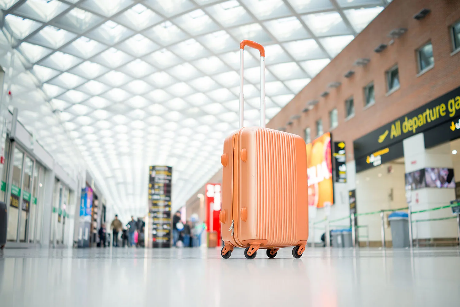 orange suitcase in airport