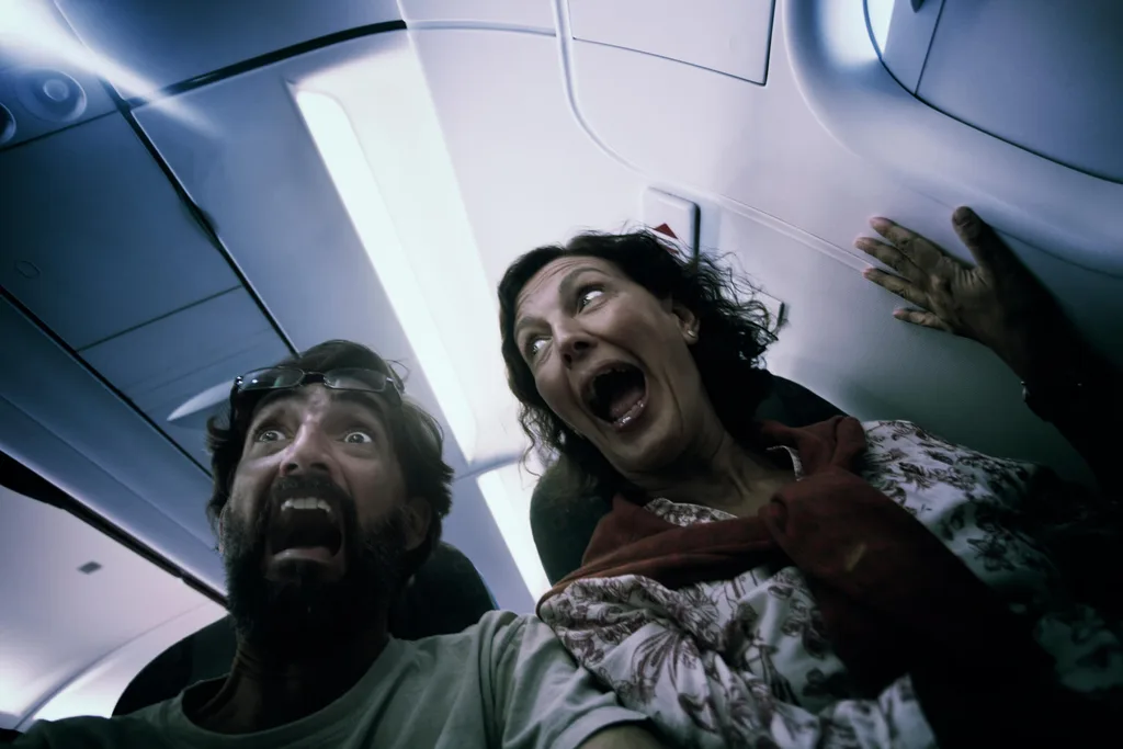 Two middle aged terrified passengers