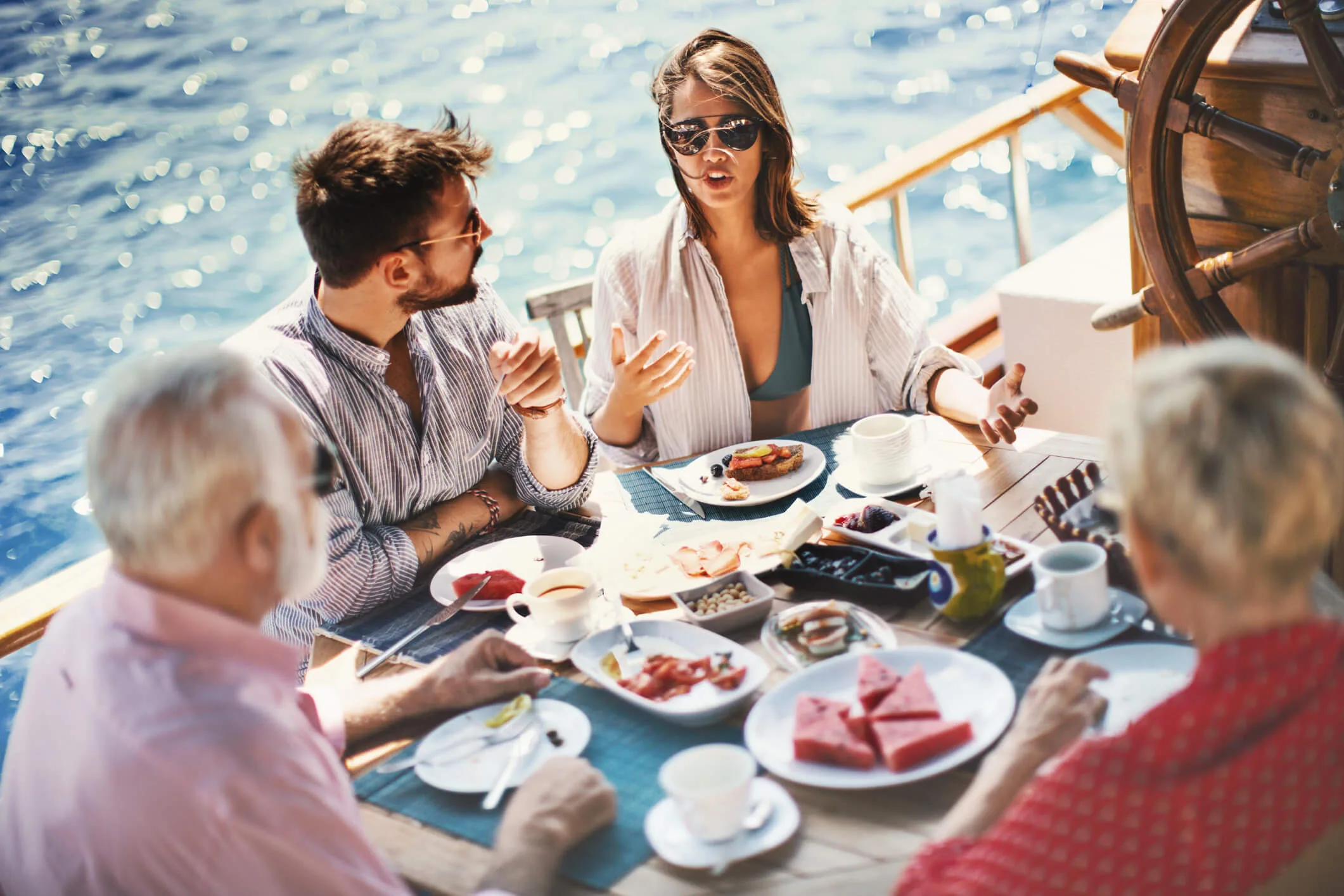 Four people having a meal together on a cruise ship