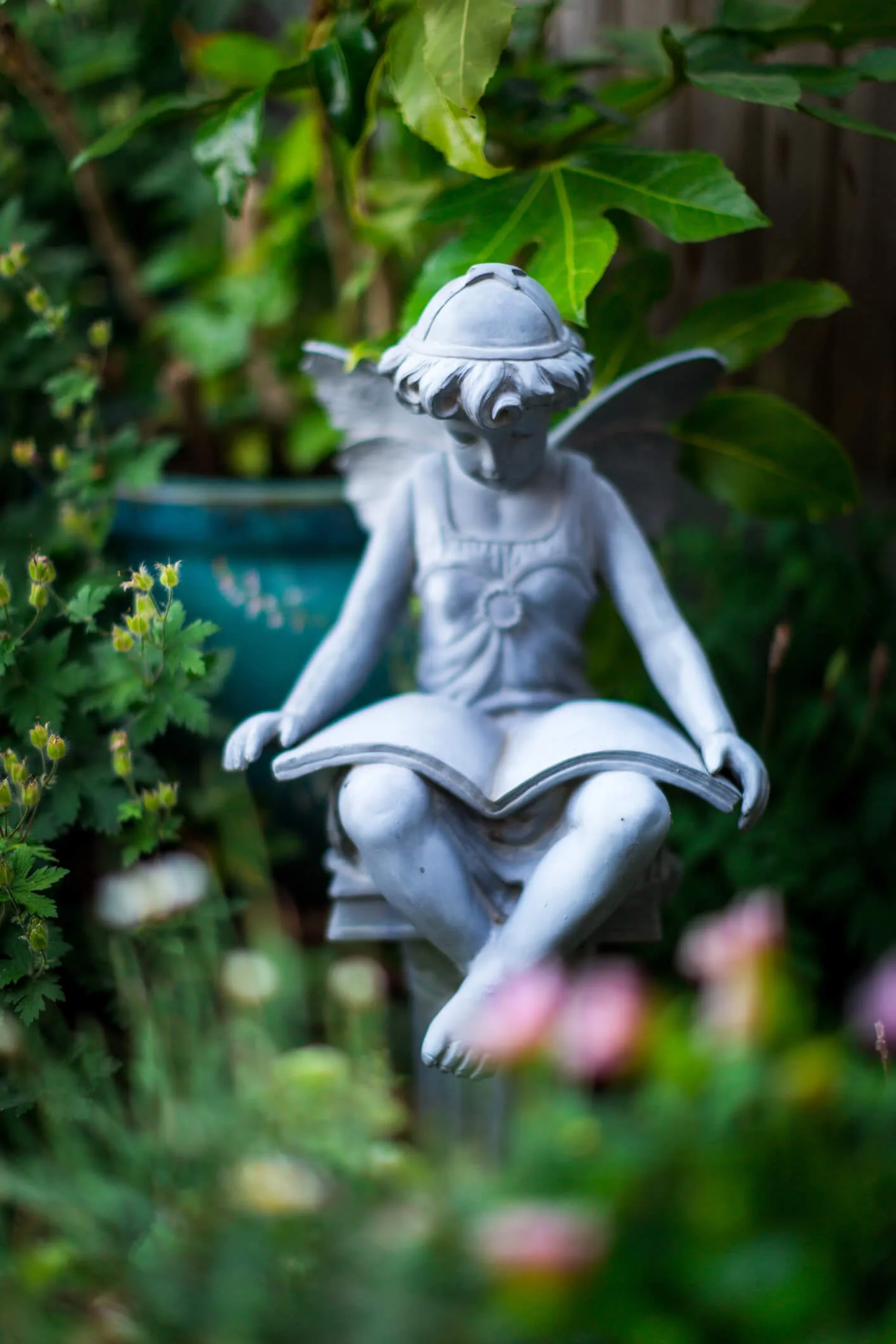 A small fairy statue in a garden