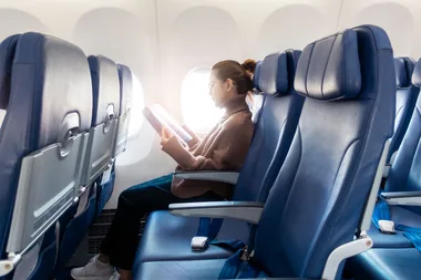 woman sitting in plane