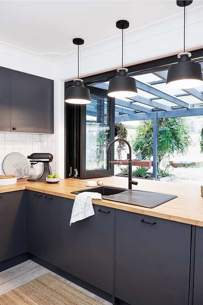 Black and timber renovated kitchen with bi-fold windows