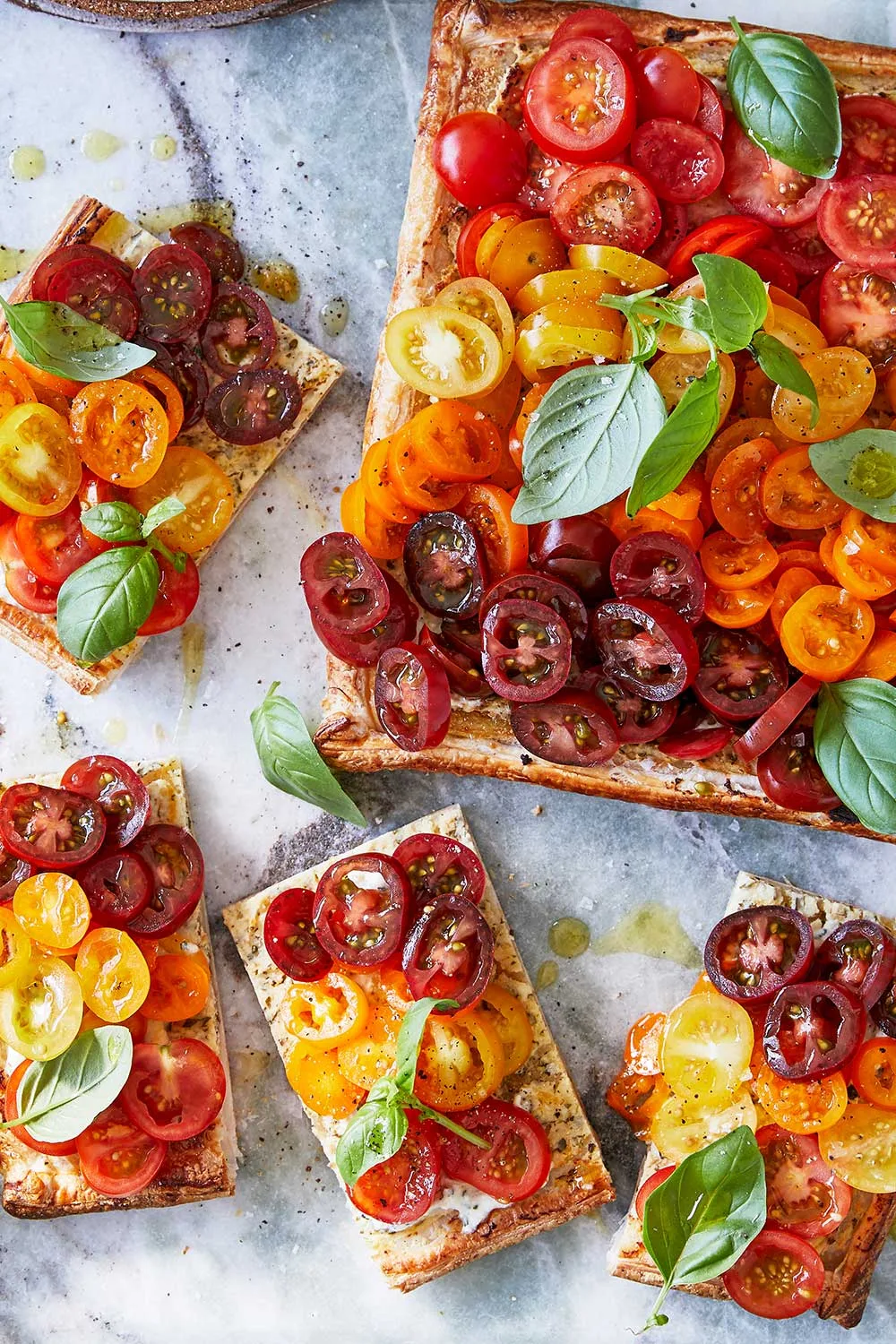 tomato tart with cherry tomatoes sliced and basil on top