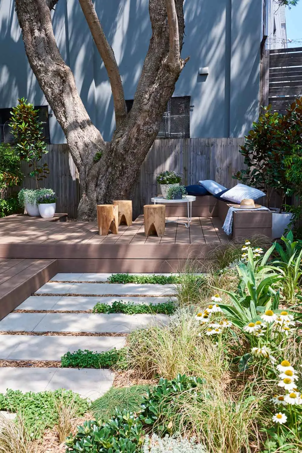 Landscaped garden with pavers and stepped deck