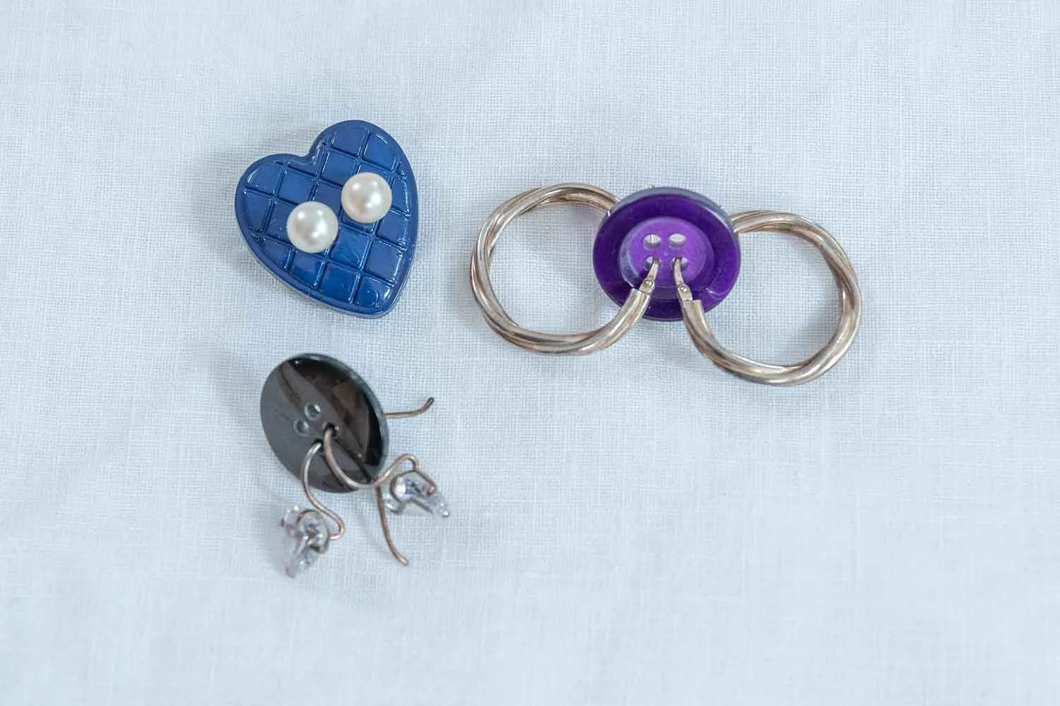 Earrings threaded into buttons