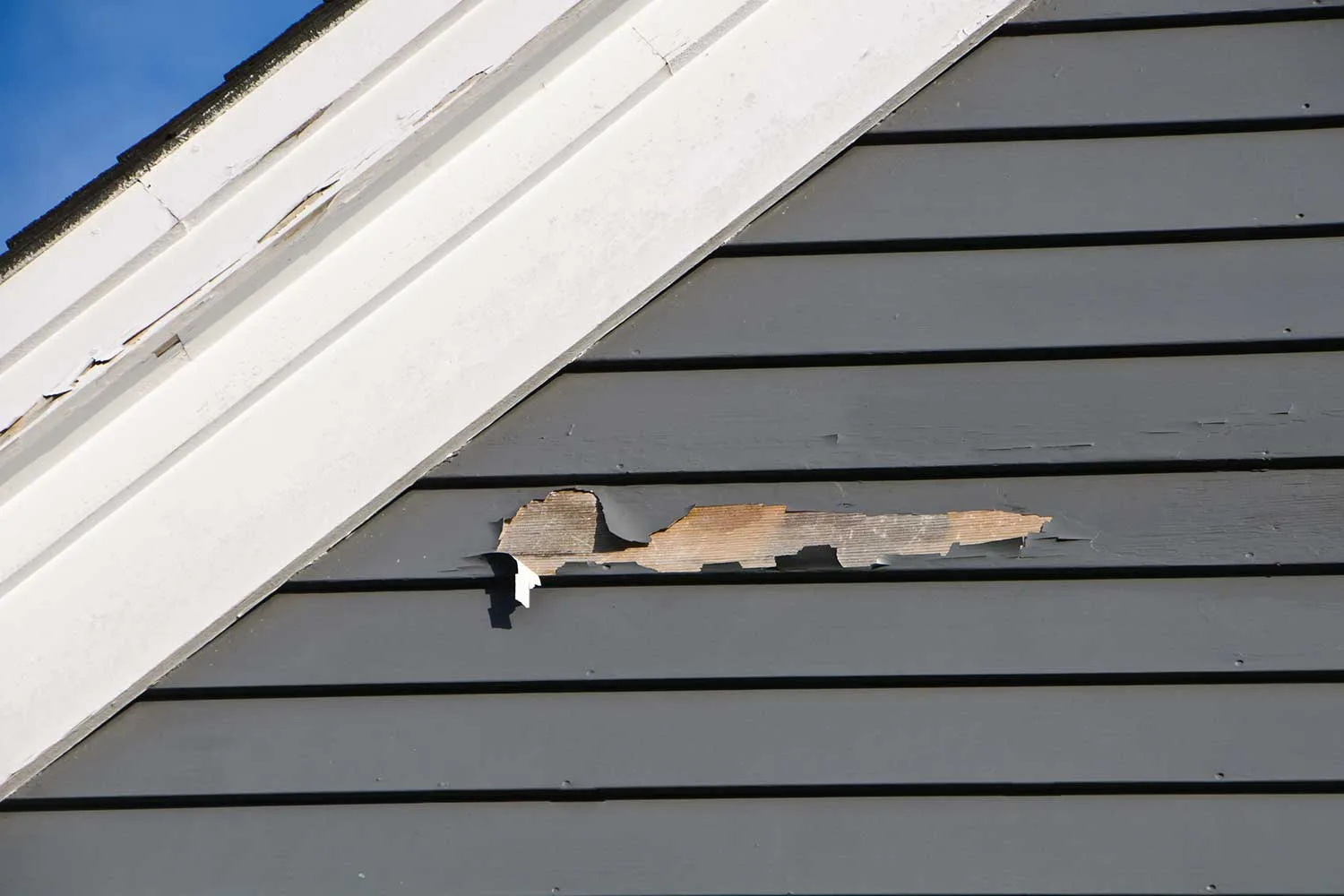 Flaking paint on weatherboard house