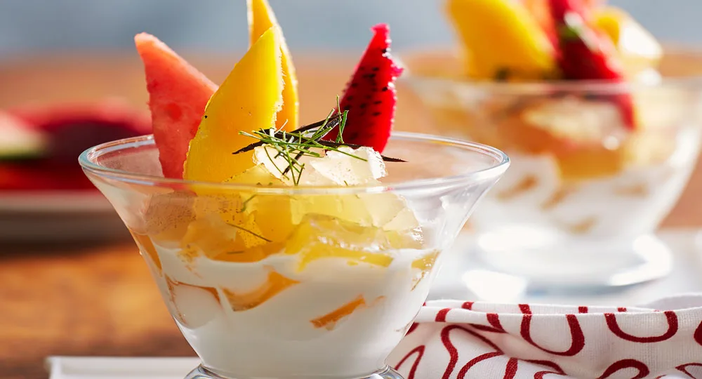 Vanilla, ginger and lime jelly with tropical fruit and coconut cream - Better Homes &amp; Gardens Australia