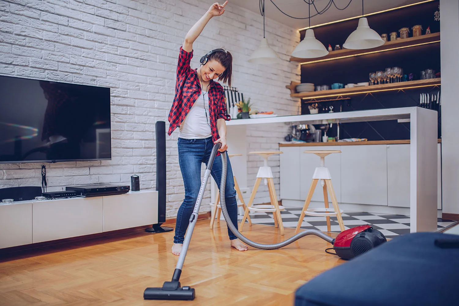 woman dancing with vacuum