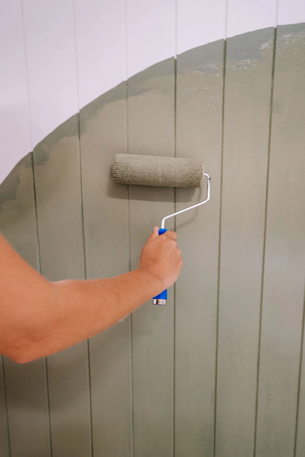 painting wall with green paint