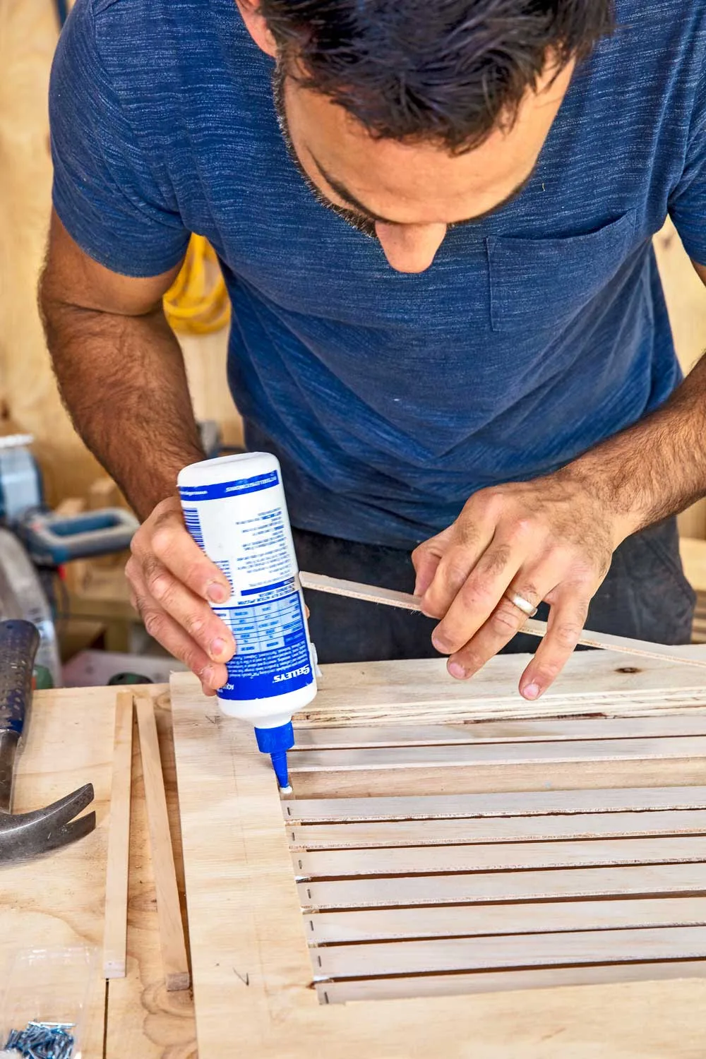 Glue slats in position on screen