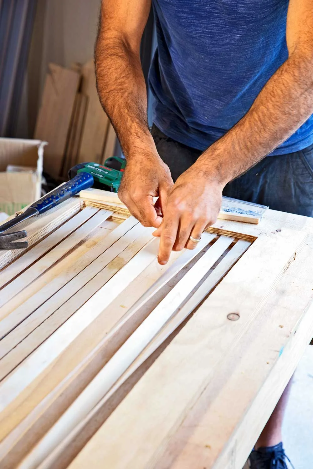 Glue and staple slats to screen