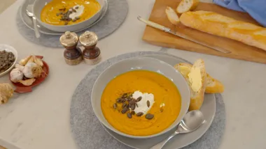 Roasted carrot and ginger soup with sour cream and pepitas