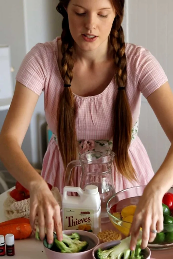 Woman soaking vegetables