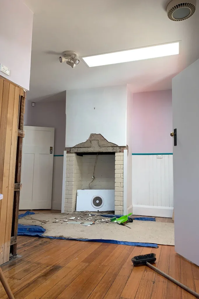 Dining room renovations with fireplace stripped back