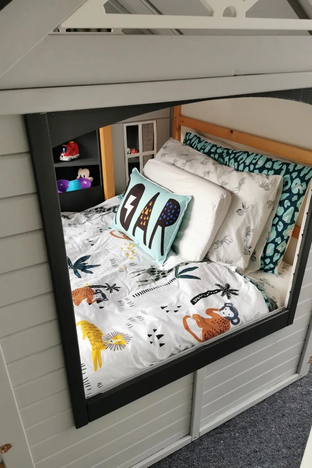 Bed in cubby with bedding