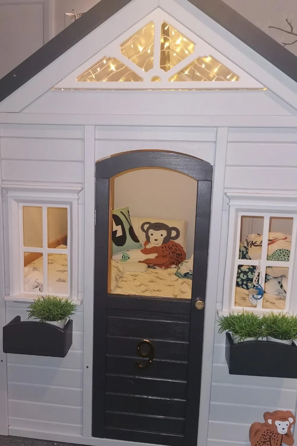 Inside cubby house at night with fairy lights