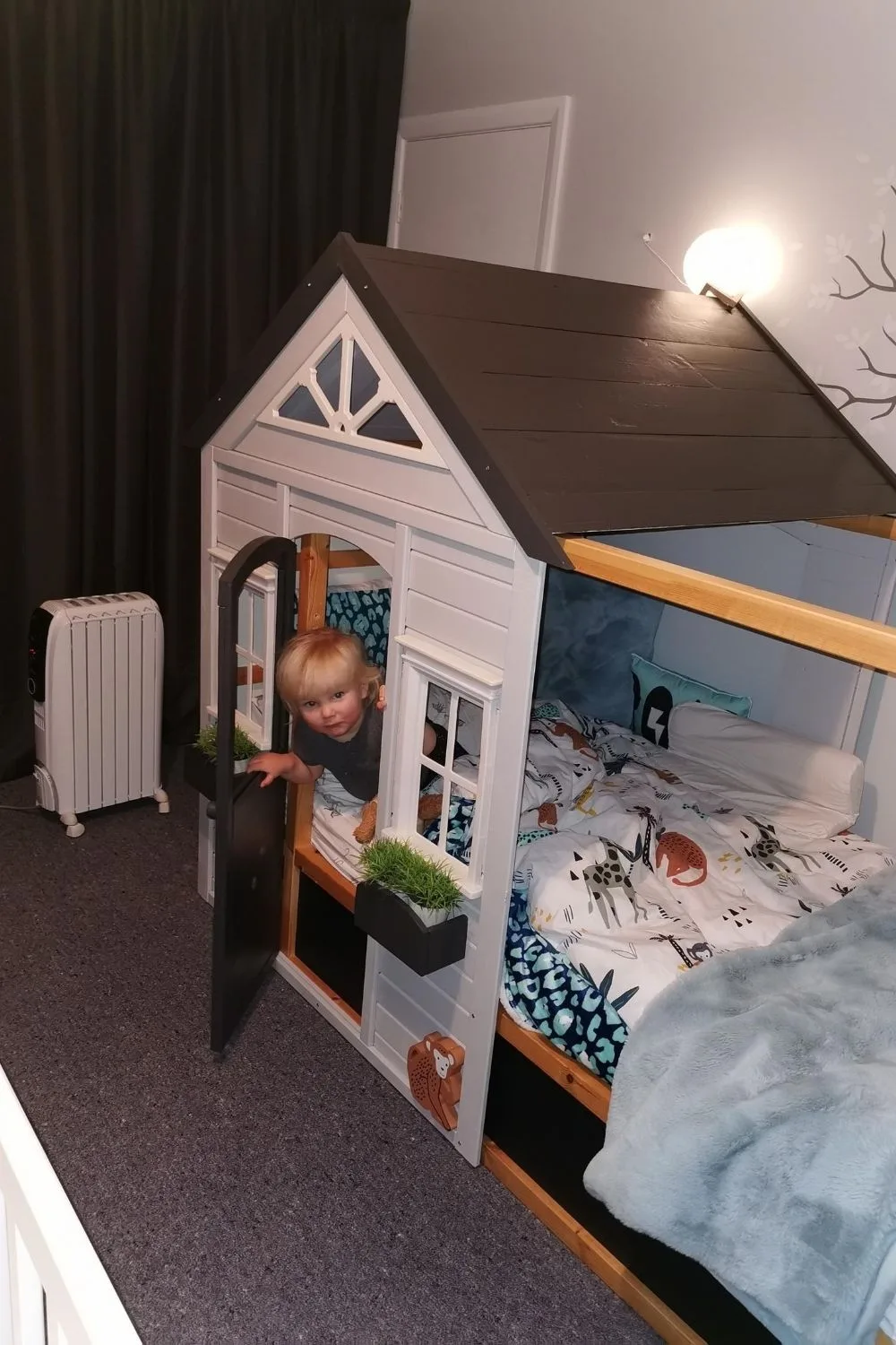 cubby bed with Ollie playing inside