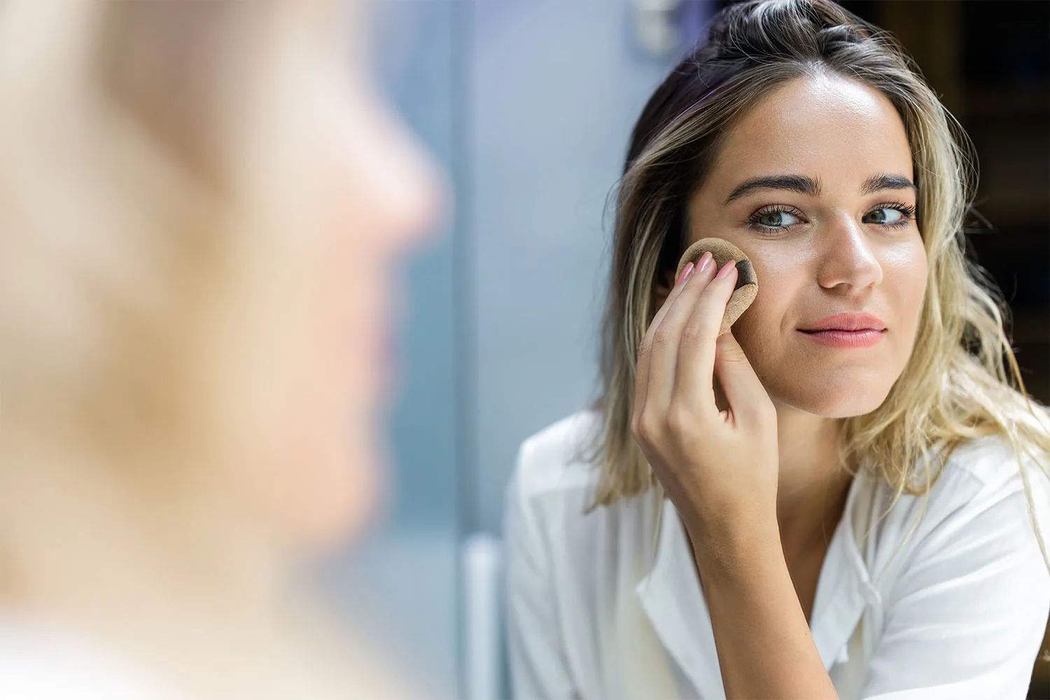 Woman applying powder