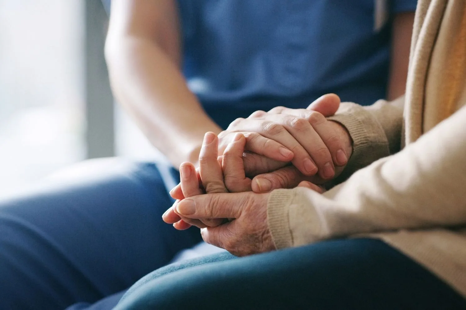 two women holding hands