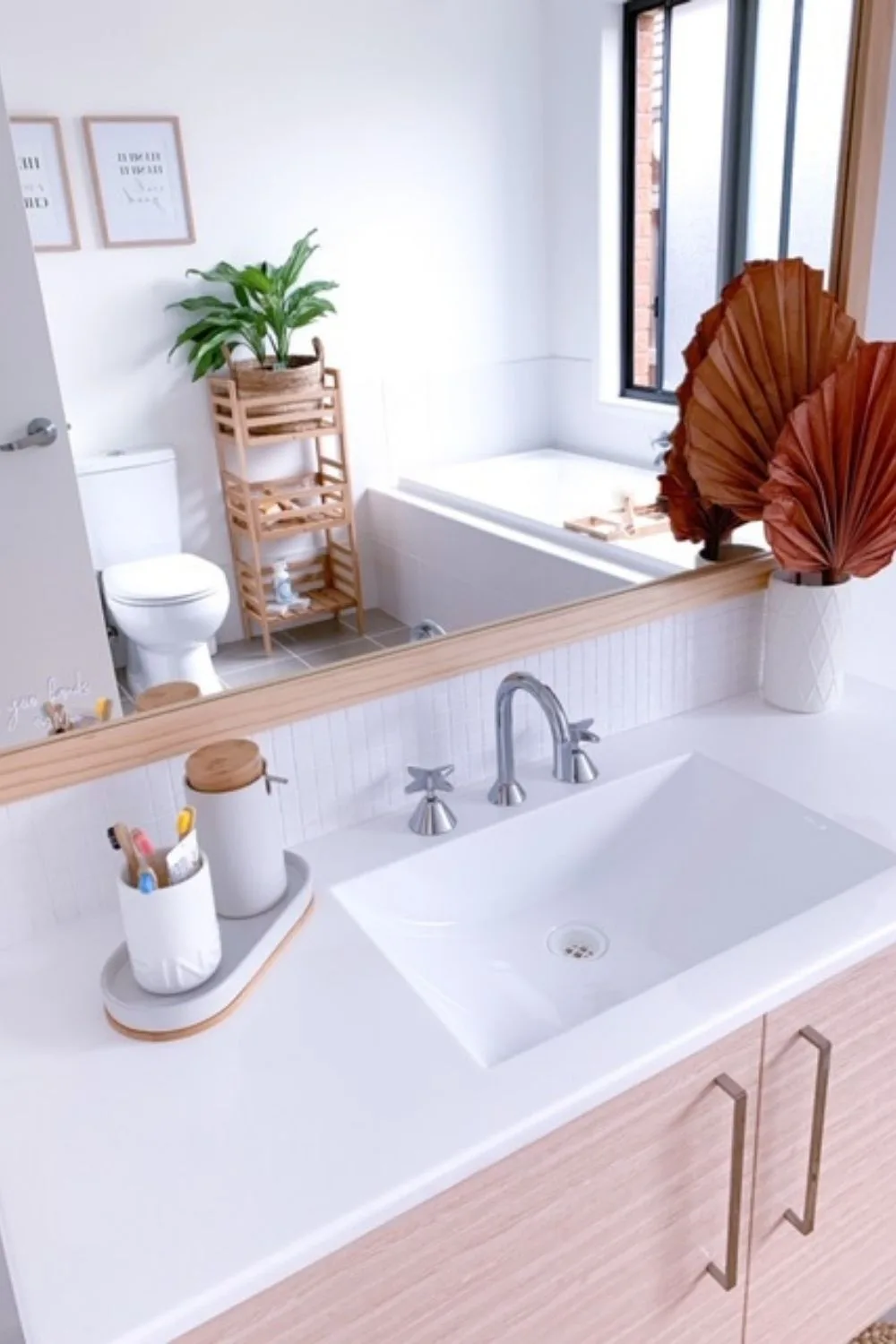 Wood framed mirror and clean sink