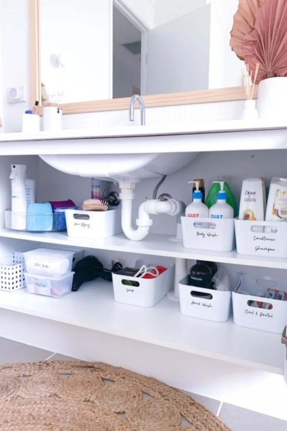 Organised tubs under sink with labels