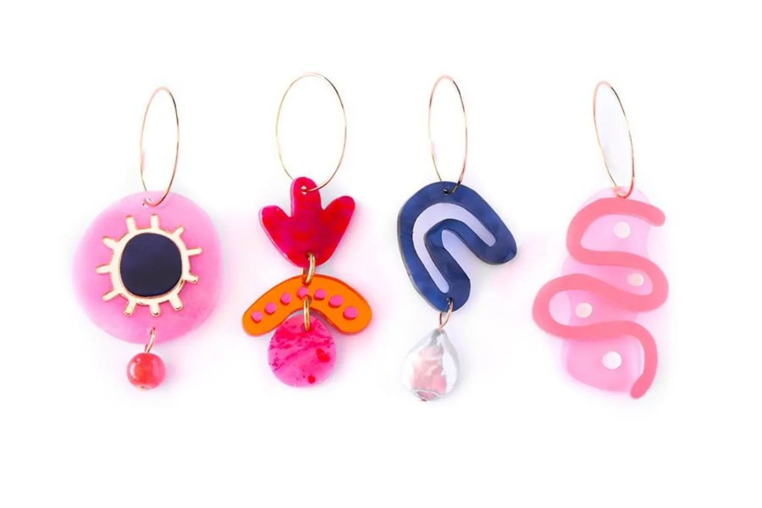 four bright earrings lined up