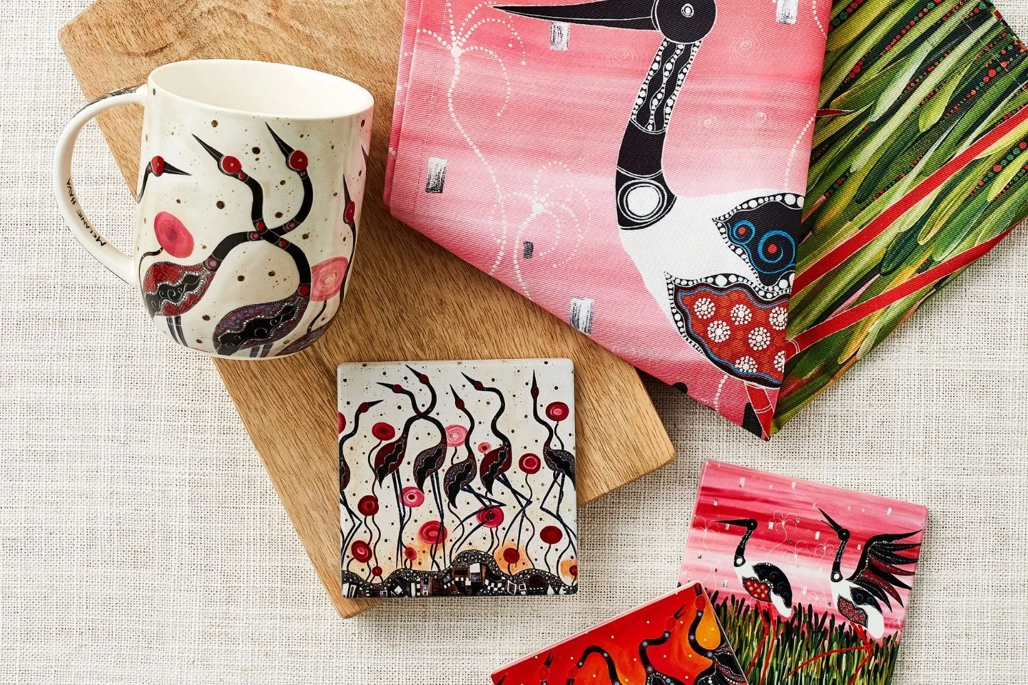 Coaster,s tea towel and mug with art work on them