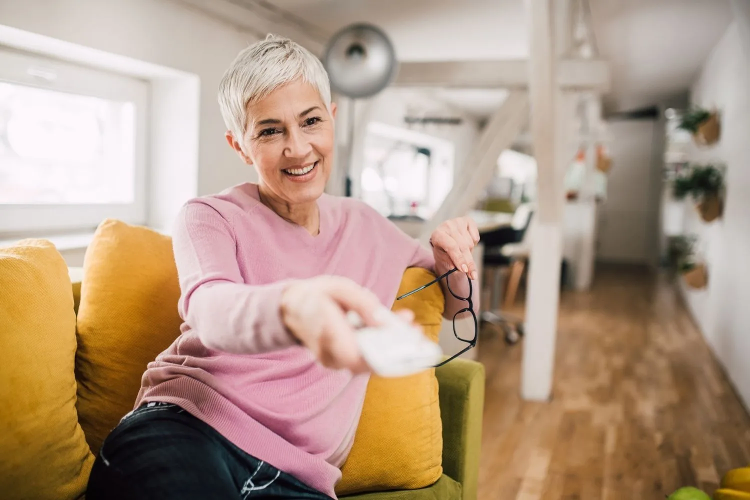 Woman clicking remote