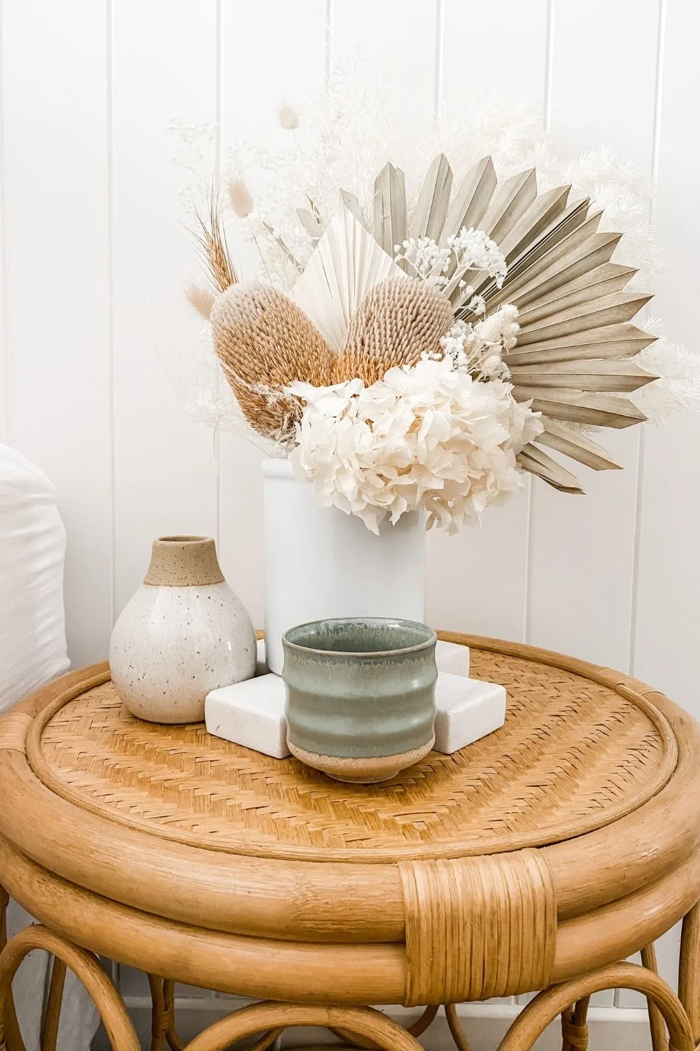 bedside table with vase and flowers