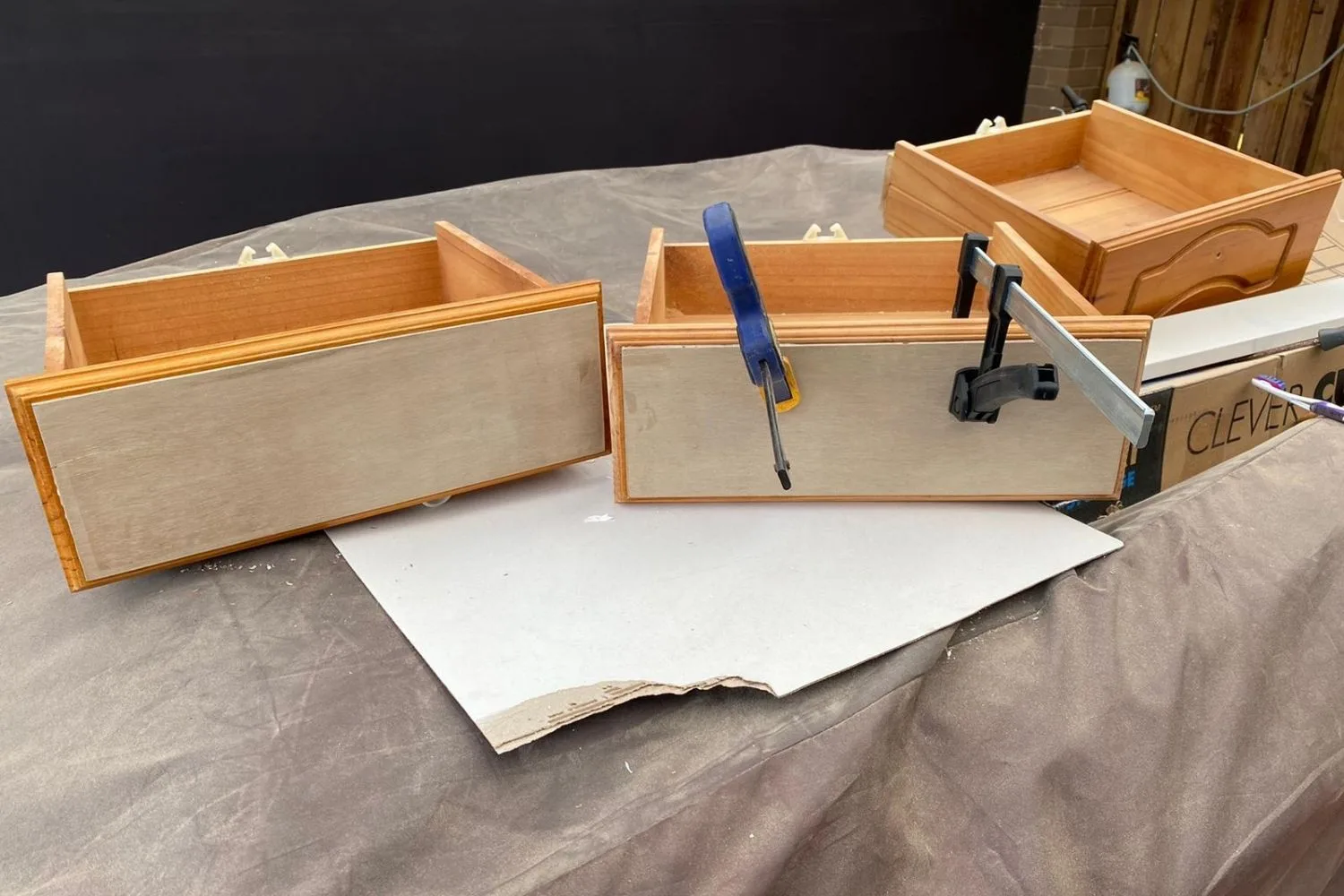 three empty draws being fitted for knobs