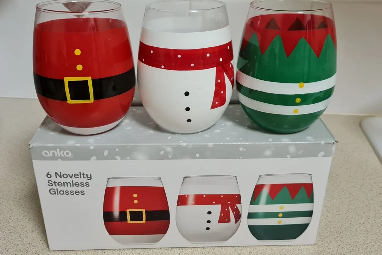 three stemless christmas themed cups