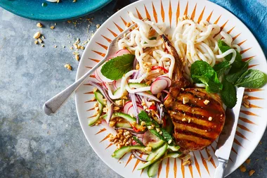 Sticky glazed pork cutlets with noodles and cucumber-peanut salad