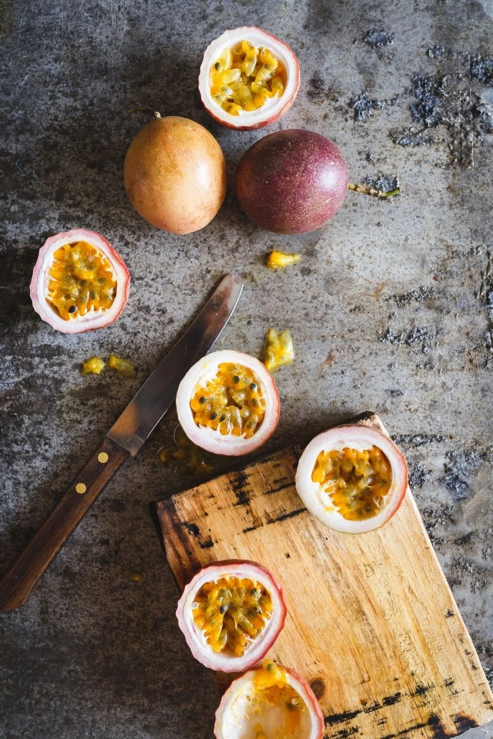 Passion fruit can be cut in half, although some people enjoy pulling them apart by hand too.