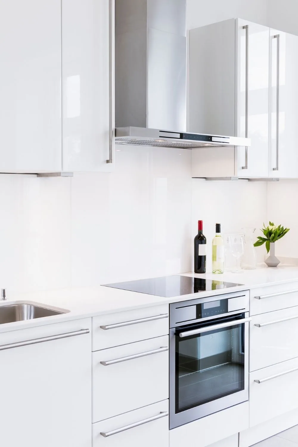 Stainless steel oven in a white kitchen