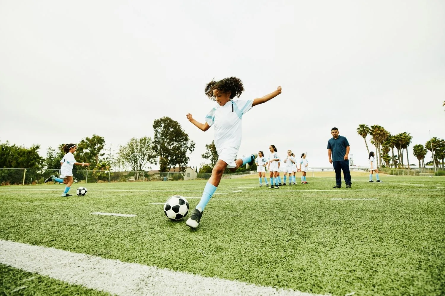 girl playing soccer