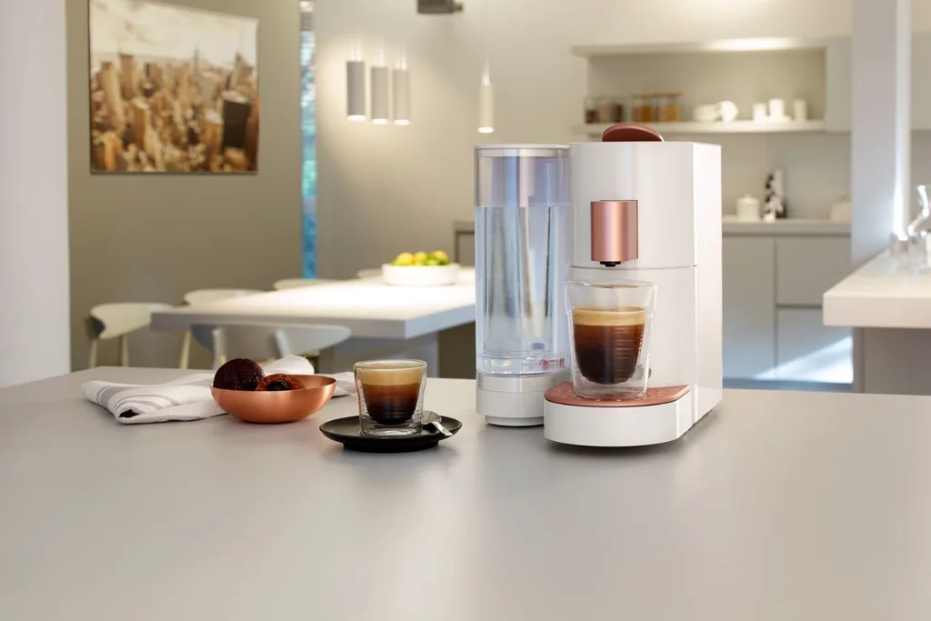K-Fee coffee machine on a grey benchtop