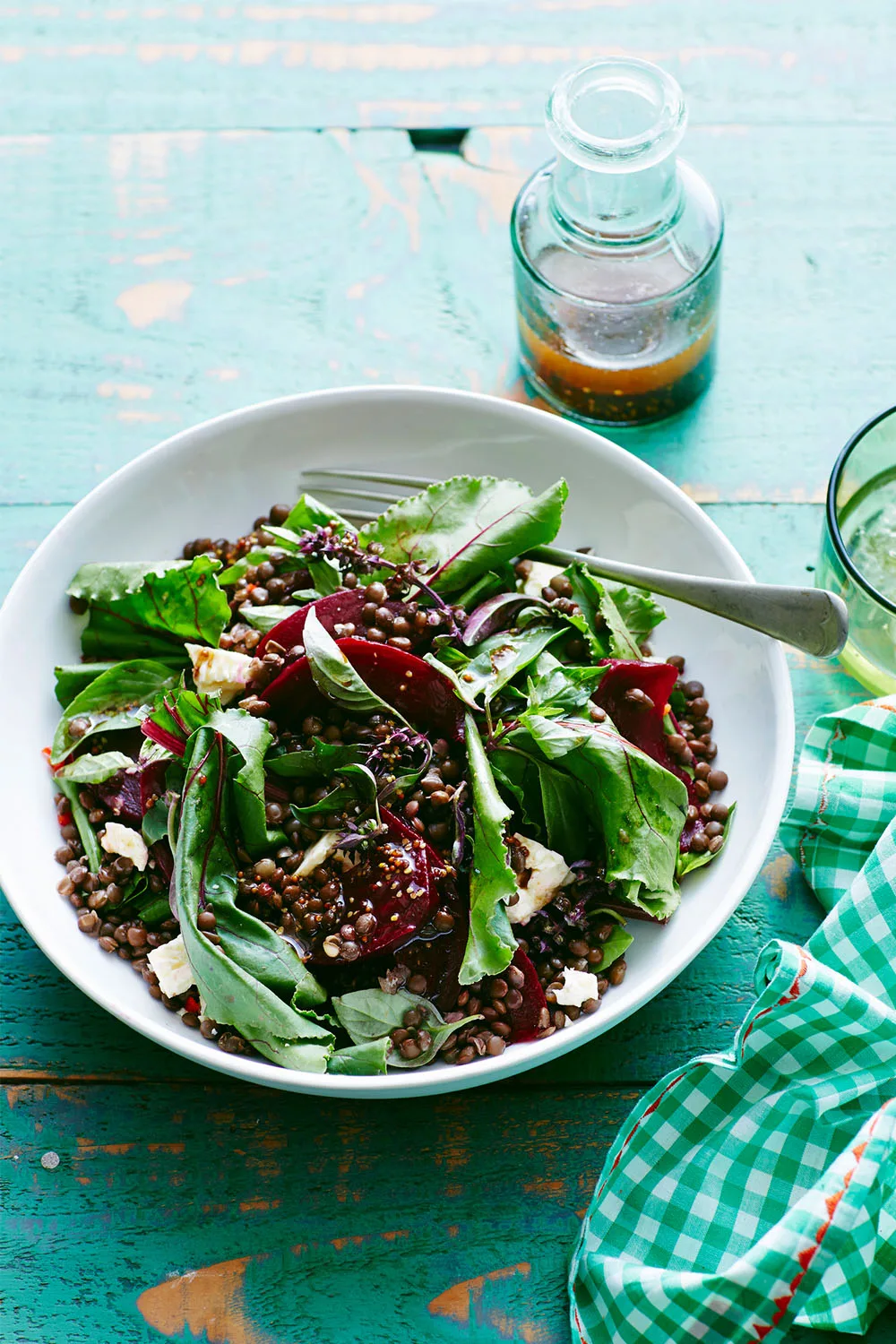 Lentil salad in a bowl with beetroots and salad leaves