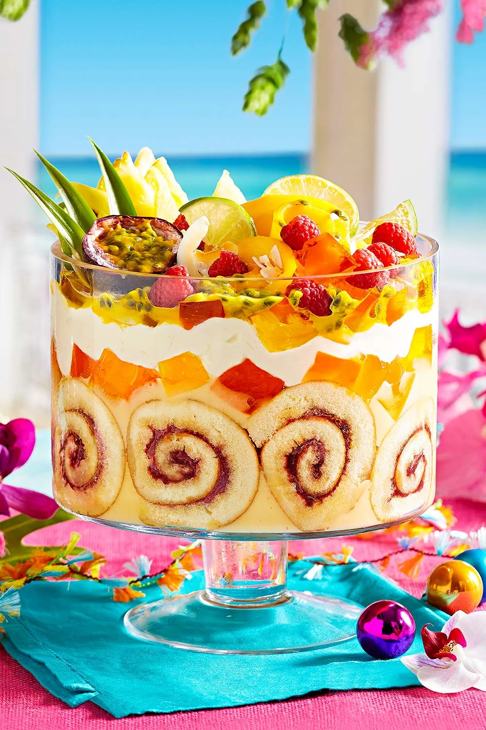 pina colada trifle with swirls of jam scrolls and tropical fruit on top of best christmas dessert