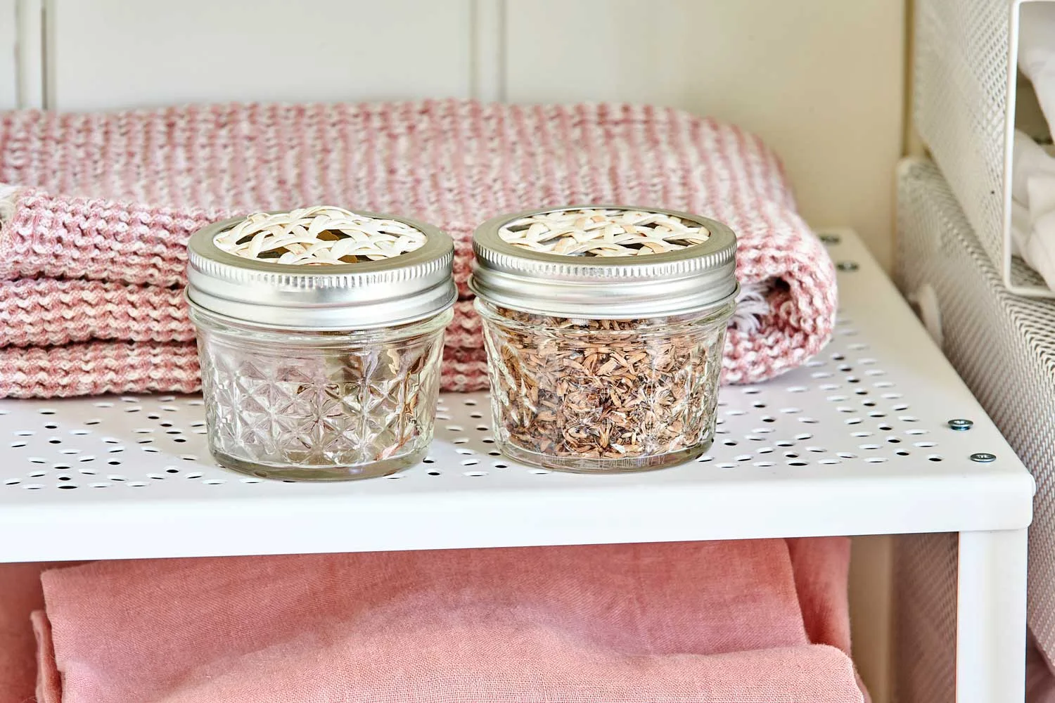 Jars of pot pourri in a linen closet