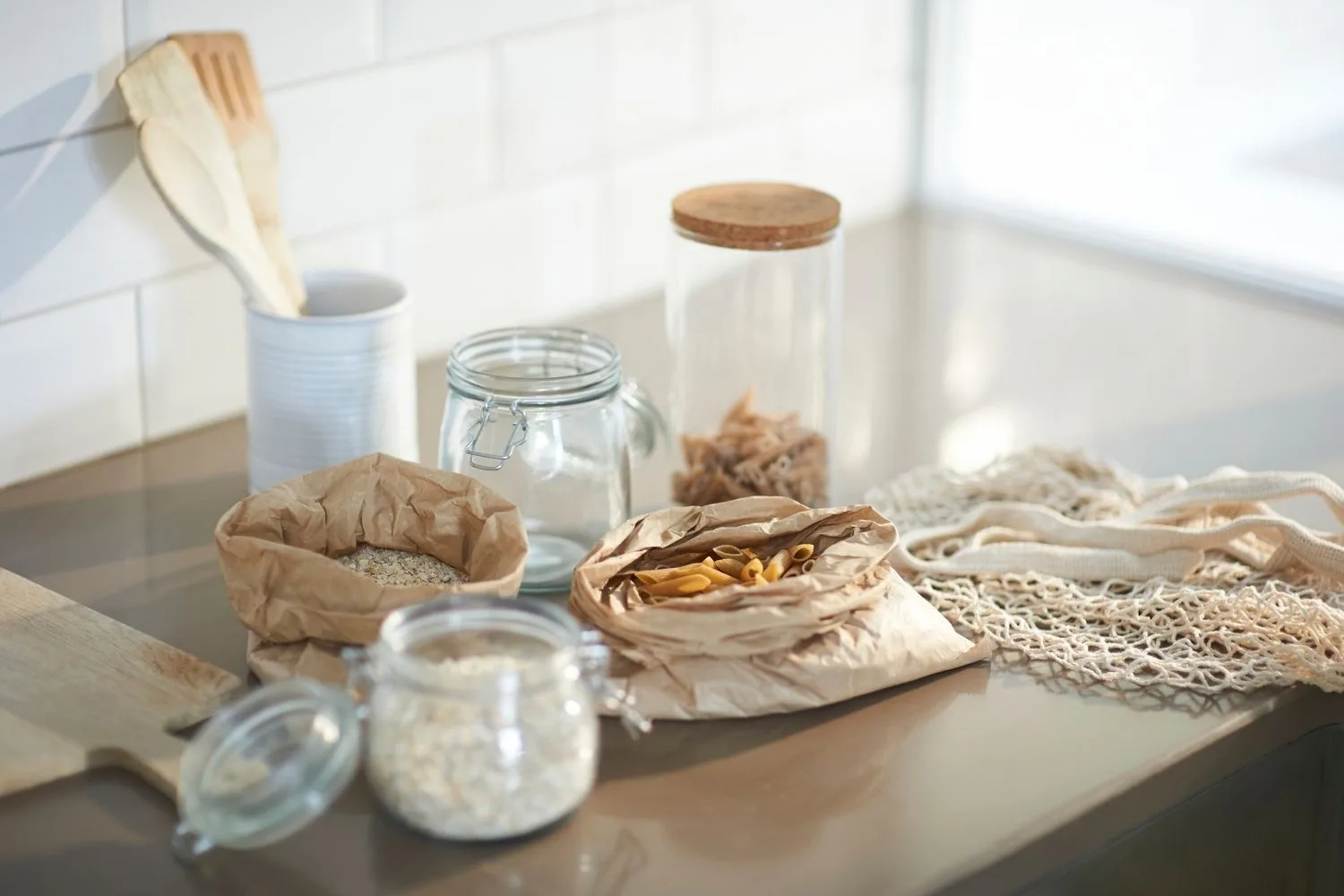 Seeds, grains and pasta on a kitchen bench