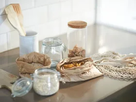 Seeds, grains and pasta on a kitchen bench