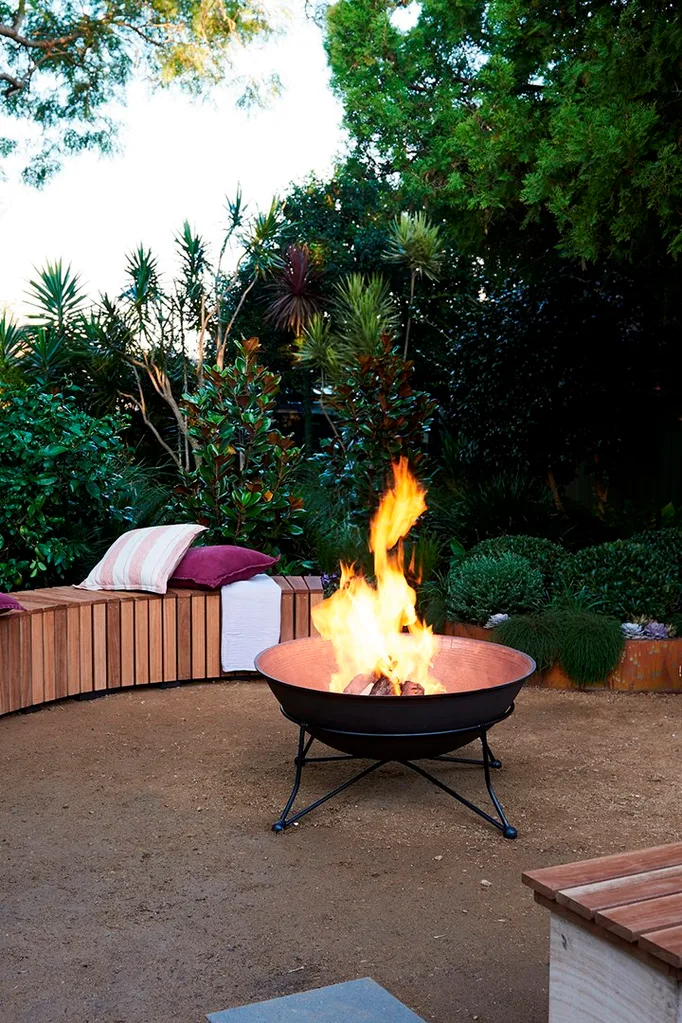 Fire pit surrounded by timber bench seating