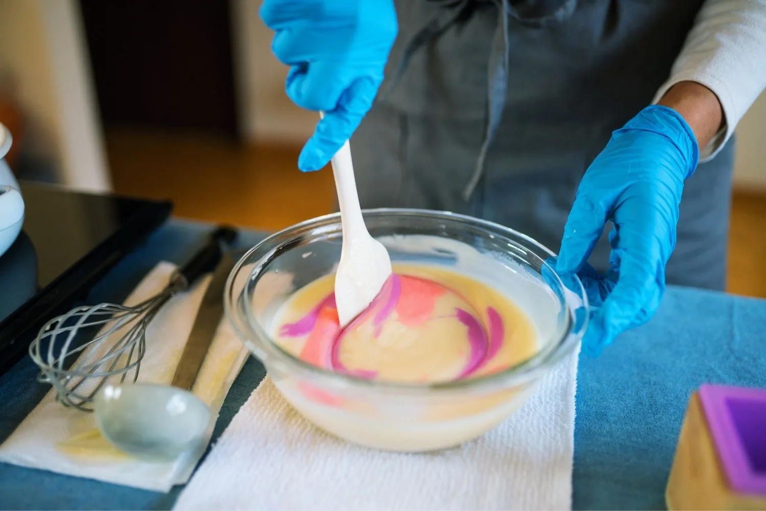 woman making soap in a bowl