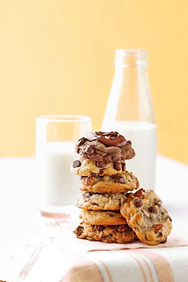 Ultimate chocolate chip cookies with milk glass behind